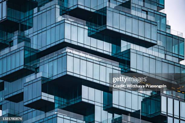 low angle view of skyscrapers - außenaufnahme von gebäuden stock-fotos und bilder