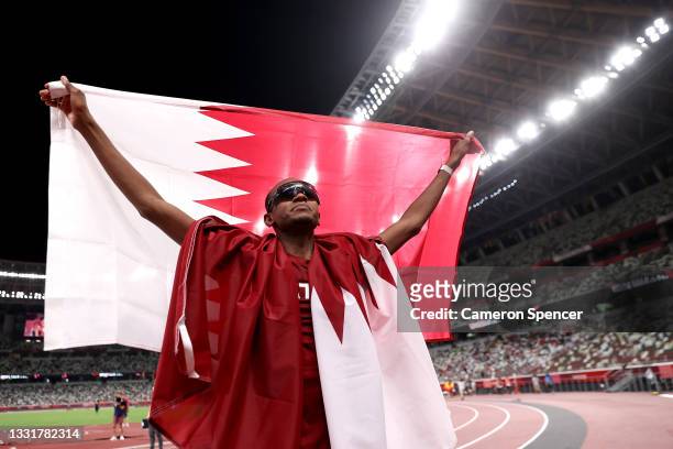Gold medalist Mutaz Essa Barshim of Team Qatar celebrates on the track following the Men's High Jump Final on day nine of the Tokyo 2020 Olympic...