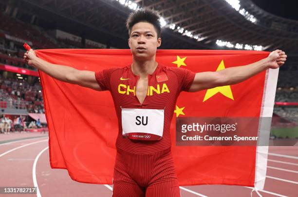 Bingtian Su of Team China reacts on the track following the Men's 100m Final on day nine of the Tokyo 2020 Olympic Games at Olympic Stadium on August...
