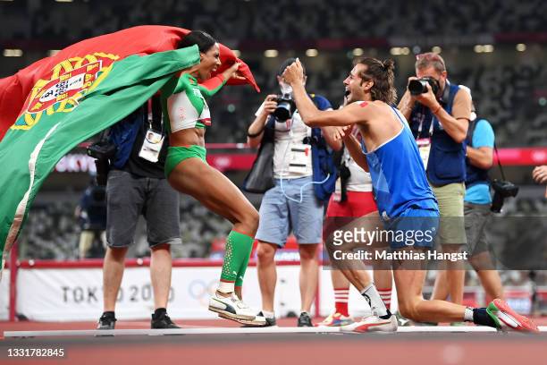Gianmarco Tamberi of Team Italy reacts after winning the gold medal in the men's High Jump with Women's Triple Jump Final silver medalist Patricia...