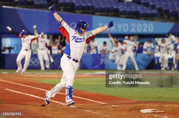 Hyunsoo Kim of Team South Korea celebrates after hitting an RBI single in the ninth inning to win the game during the round one of baseball team...