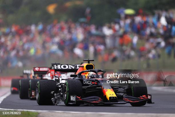 Max Verstappen of the Netherlands driving the Red Bull Racing RB16B Honda with a broken bargeboard during the F1 Grand Prix of Hungary at Hungaroring...