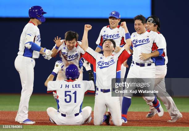 Team South Korea celebrate winning the round one of baseball team competition match between Team Dominican Republic and Team South Korea on day nine...