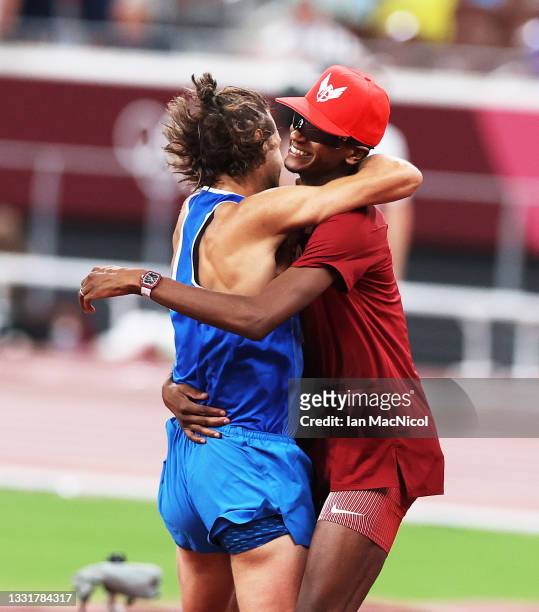 Gianmarco Tamberi of Italy celebrates sharing the gold medal with Muta Essa Barshim of Qatar in the High Jump on day nine of the Tokyo 2020 Olympic...