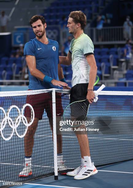 Karen Khachanov of Team ROC congratulates Alexander Zverev of Team Germany on his victory after their Men's Singles Gold Medal match on day nine of...