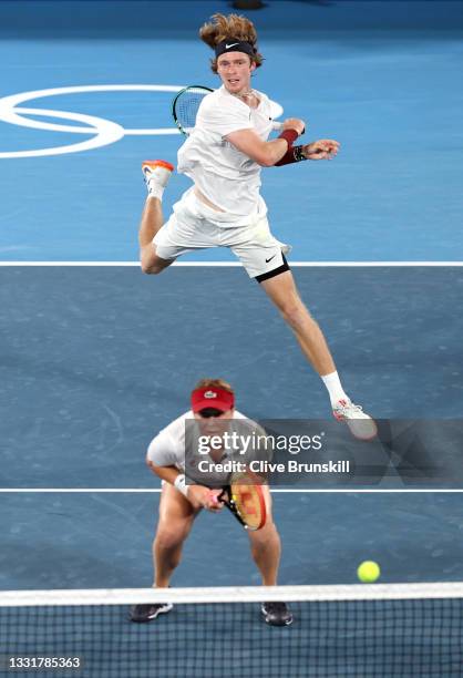 Andrey Rublev of Team ROC and Anastasia Pavlyuchenkova of Team ROC play Aslan Karatsev of Team ROC and Elena Vesnina of Team ROC during their Mixed...