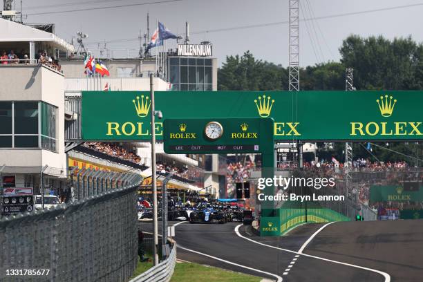 Most of the field line up in the Pitlane for the restart during the F1 Grand Prix of Hungary at Hungaroring on August 01, 2021 in Budapest, Hungary.