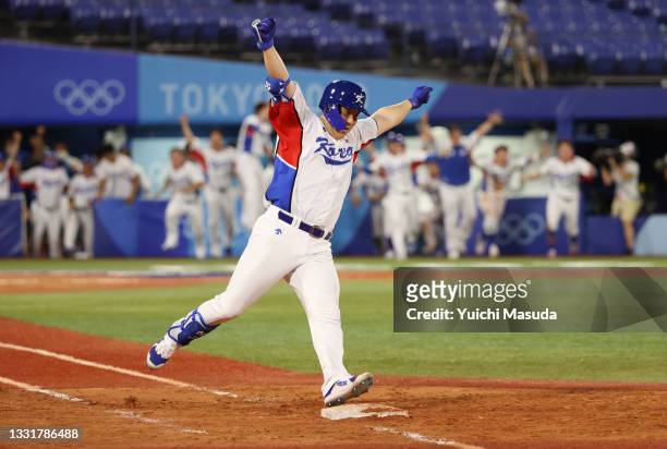 Hyunsoo Kim of Team South Korea celebrates after hitting an RBI single in the ninth inning to win the game during the round one of baseball team...