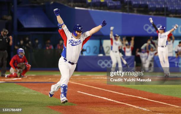 Hyunsoo Kim of Team South Korea celebrates after hitting an RBI single in the ninth inning to win the game during the round one of baseball team...