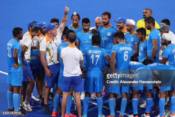 Graham John Reid, Team India Head Coach speaks with players following the Men's Quarterfinal match between India and Great Britain on day nine of the...