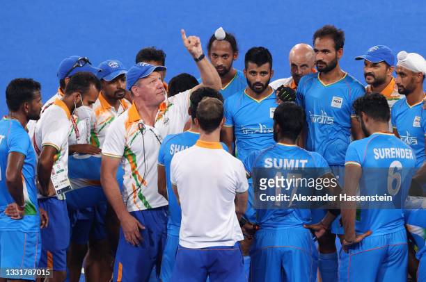 Graham John Reid, Team India Head Coach speaks with players following the Men's Quarterfinal match between India and Great Britain on day nine of the...