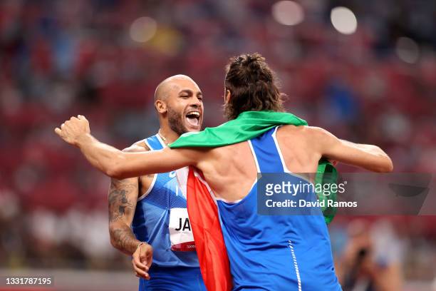 Lamont Marcell Jacobs of Team Italy is congratulated by teammate Gianmarco Tamberi after winning the Men's 100m Final on day nine of the Tokyo 2020...