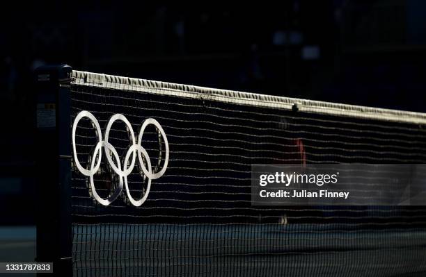 The Olympic rings are illuminated on the net before the Women's Doubles Gold Medal match between Katerina Siniakova of Team Czech Republic and...