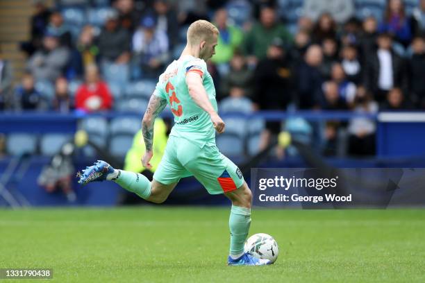 Lewis O'Brien of Huddersfield Town scores the winning penalty during the Carabao Cup First Round match between Sheffield Wednesday and Huddersfield...