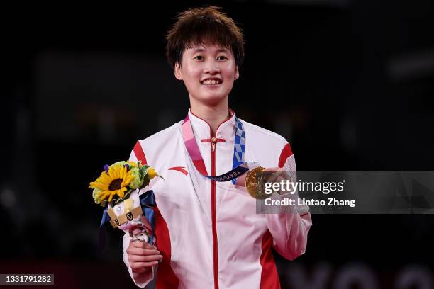 Gold medalist Chen Yu Fei of Team China poses on the podium during the medal ceremony for the Women’s Singles badminton event on day nine of the...