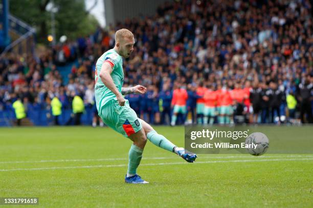 Lewis O'Brien of Huddersfield Town scores the winning penalty during the Carabao Cup game between Sheffield Wednesday and Huddersfield Town at...