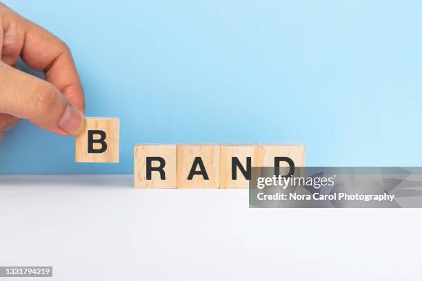 brand spelling wood toy block - branding identity stock pictures, royalty-free photos & images