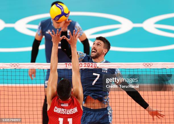 Micah Christenson of Team United States competes against Facundo Conte of Team Argentina during the Men's Preliminary Round - Pool B volleyball on...