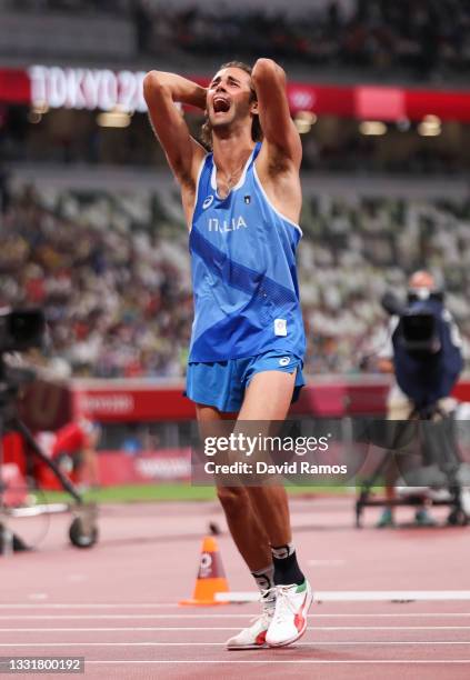 Gold medalist Gianmarco Tamberi of Team Italy celebrates on the track following the Men's High Jump Final on day nine of the Tokyo 2020 Olympic Games...