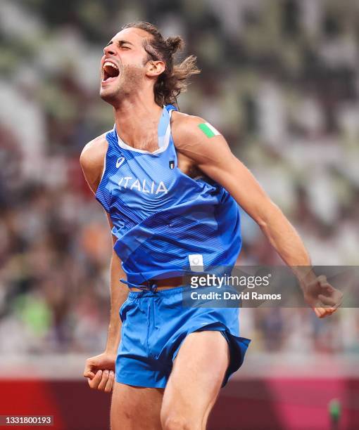 Gold medalist Gianmarco Tamberi of Team Italy celebrates on the track following the Men's High Jump Final on day nine of the Tokyo 2020 Olympic Games...