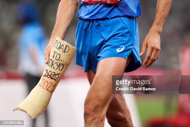 Gold medalist Gianmarco Tamberi of Team Italy holds a shell of an old cast inscribed 'Road to Tokyo 2020, 2021' during the Men's High Jump Final on...