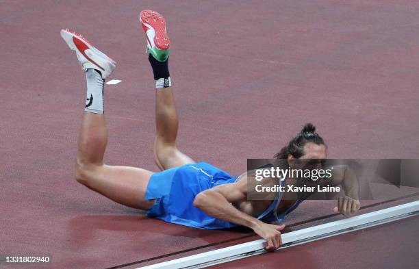 Gianmarco Tamberi of Team Italy celebrates after agreeing to share gold with Mutaz Essa Barshim of Team Qatar in the Men's High Jump Final on day...