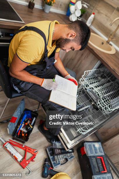 plumber solving a problem - clogged pipe stock pictures, royalty-free photos & images