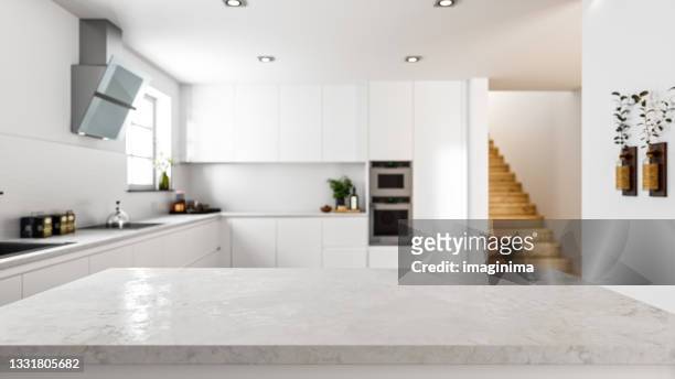 empty stone kitchen countertop in modern kitchen - focus on foreground stock pictures, royalty-free photos & images