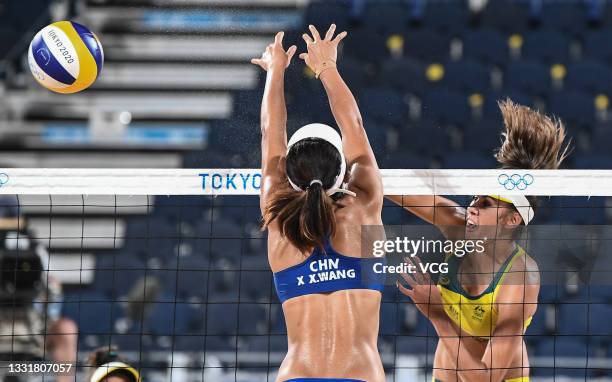 Wang Xinxin of Team China defends against Team Australia during the Women's Round of 16 beach volleyball match on day nine of the Tokyo 2020 Olympic...