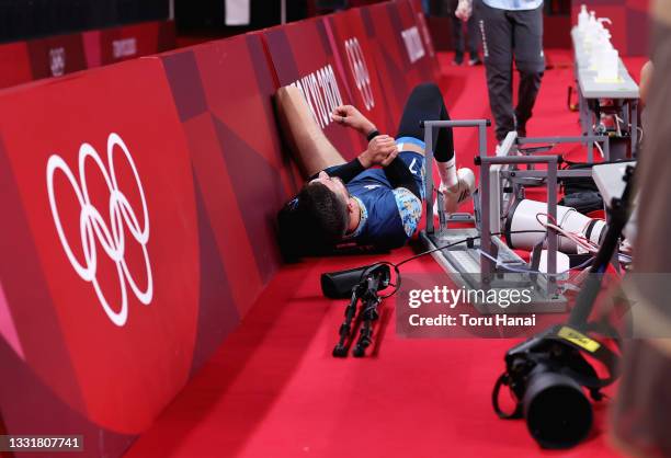 Facundo Conte of Team Argentina lies near cameras and seats after falling against Team United States during the Men's Preliminary Round - Pool B...