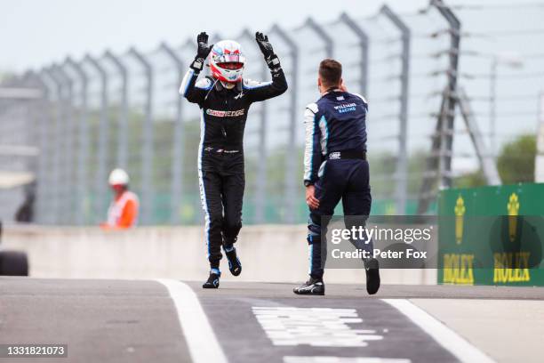 Esteban Ocon of France and Renault runs down the pitlane after winning the F1 Grand Prix of Hungary at Hungaroring on August 01, 2021 in Budapest,...