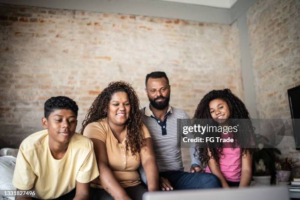 family watching something at home - brazil girls supporters stock pictures, royalty-free photos & images