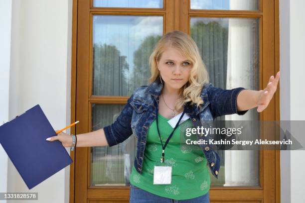 a young woman with clipboard. - guest list stock pictures, royalty-free photos & images