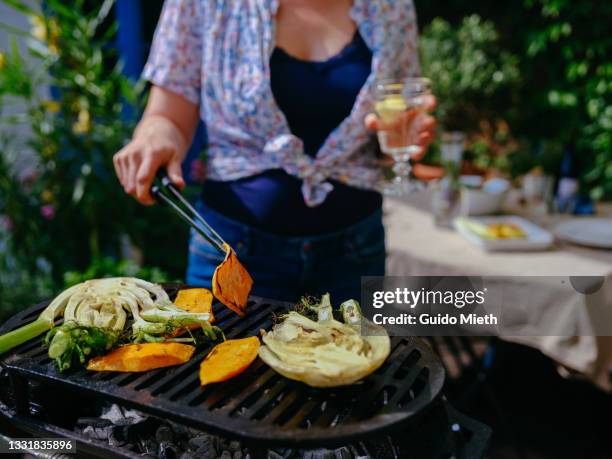 close up of vegetables cooking on barbecue on terrace. - tongs stock pictures, royalty-free photos & images