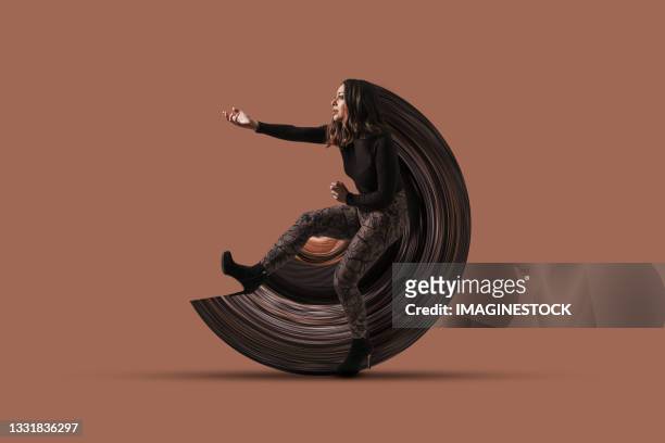 woman performing a performance by drawing a circle with her body. - budding starlets stock pictures, royalty-free photos & images