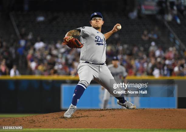Julio Urias of the Los Angeles Dodgers delivers a first inning pitch against the Arizona Diamondbacks at Chase Field on August 01, 2021 in Phoenix,...
