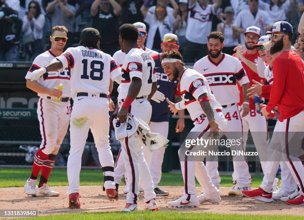 Brian Goodwin of the Chicago White Sox is congratulated by teammates following his walk off home run during the ninth inning of a game against the...