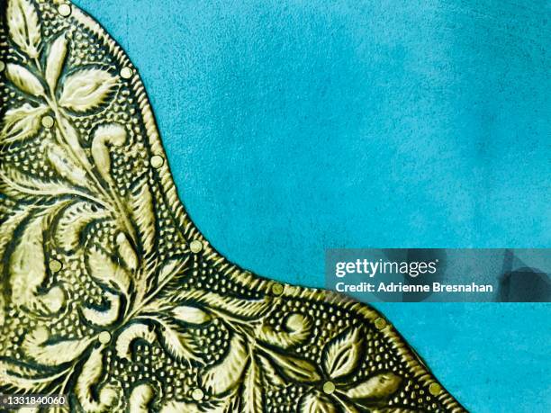 blue surface with gold leaf embellishment - suede stock pictures, royalty-free photos & images