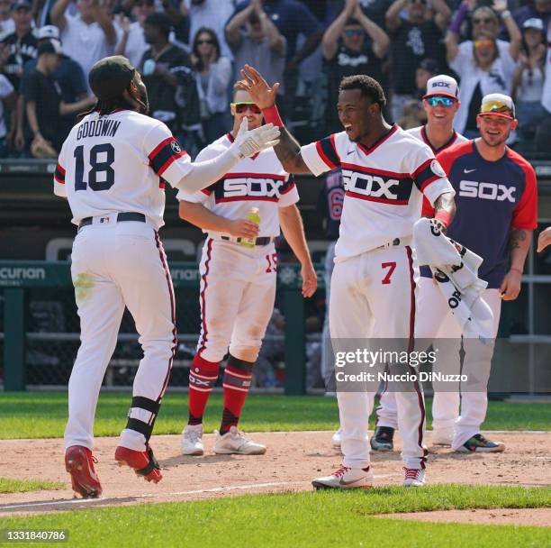 Brian Goodwin of the Chicago White Sox is congratulated by Tim Anderson following his walk off home run during the ninth inning of a game against the...