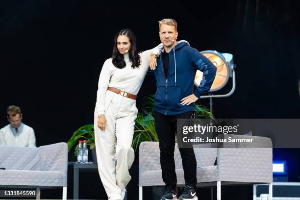 Amira Pocher and Oliver Pocher perform live onstage during the BonnLive Kulturgarten Open Air Festival on August 01, 2021 in Bonn, Germany.