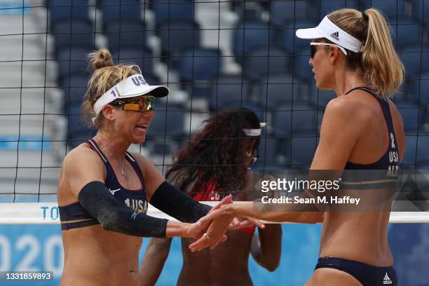 April Ross of Team United States and Alix Klineman celebrate after the play against Team Cuba during the Women's Round of 16 beach volleyball on day...