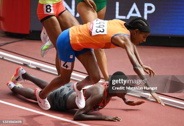 Sifan Hassan of Team Netherlands and Edinah Jebitok of Team Kenya trip and fall during round one of the Women's 1500m heats on day ten of the Tokyo...