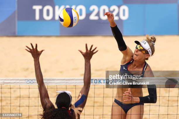 April Ross of Team United States strikes against Team Cuba during the Women's Round of 16 beach volleyball on day ten of the Tokyo 2020 Olympic Games...