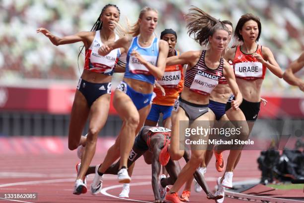 Edinah Jebitok of Team Kenya falls, tripping Sifan Hassan of Team Netherlands, in round one of the Women's 1500m heats on day ten of the Tokyo 2020...