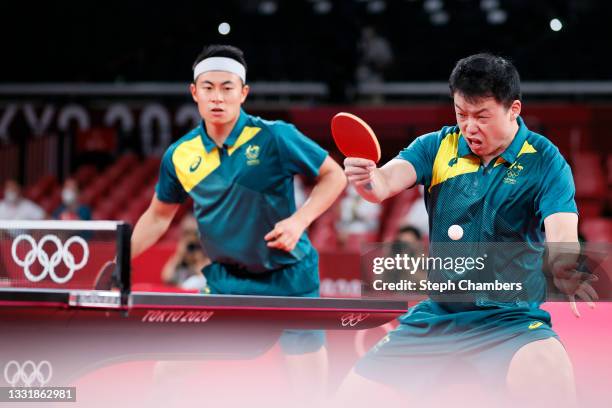 Yan Xin and Hu Heming of Team Australia in action during their Men's Team Round of 16 table tennis match on day ten of the Tokyo 2020 Olympic Games...