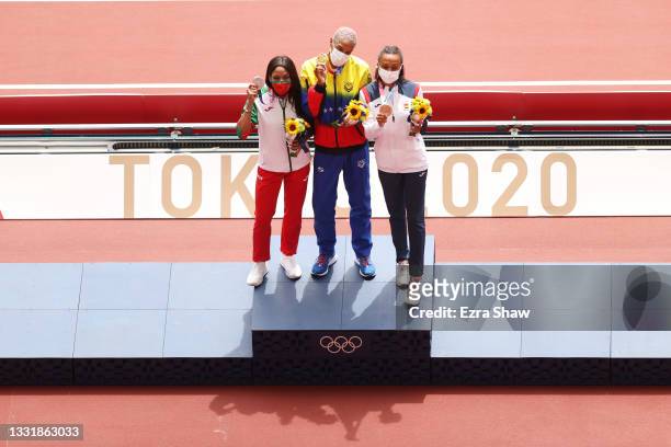 Silver medalist Patricia Mamona of Team Portugal, gold medalist Yulimar Rojas of Team Venezuela and bronze medalist Ana Peleteiro of Team Spain pose...