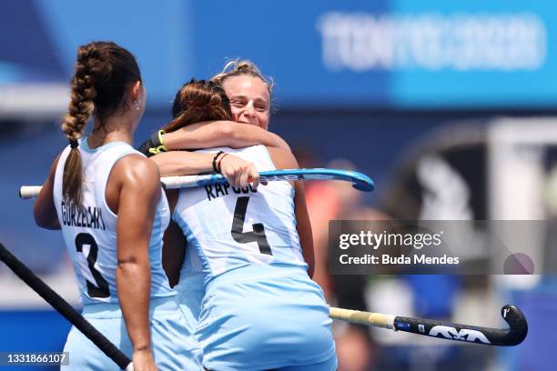 Victoria Sauze Valdez of Team Argentina celebrates scoring the third goal with Valentina Raposo Ruiz de los Llanos and Agustina Gorzelany of Team...