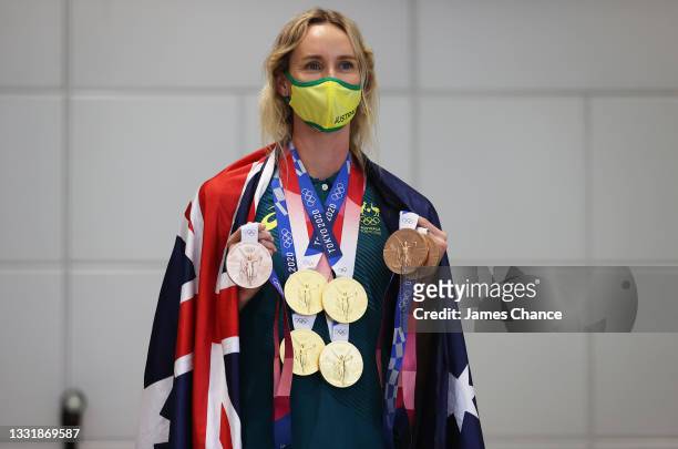 Emma McKeon of Team Australia poses for a photo with her seven Olympics medals after the Australian Swimming Medallist press conference on day ten of...