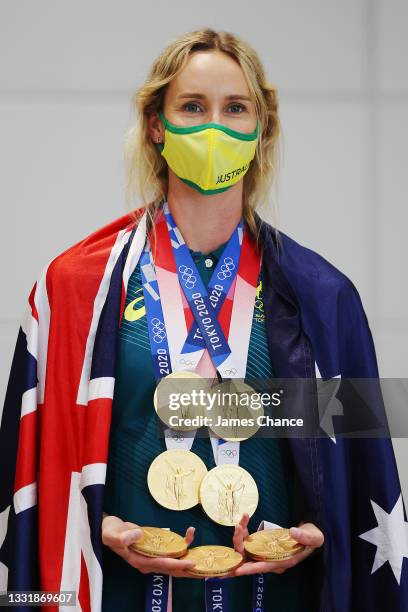 Emma McKeon of Team Australia poses for a photo with her seven Olympics medals after the Australian Swimming Medallist press conference on day ten of...