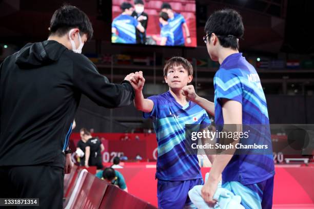 Koki Niwa and Jun Mizutani of Team Japan prepare for their Men's Team Round of 16 table tennis match on day ten of the Tokyo 2020 Olympic Games at...